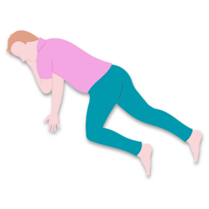 Demonstration of a recovery position, on their side, with the top leg bent and one arm under their head.